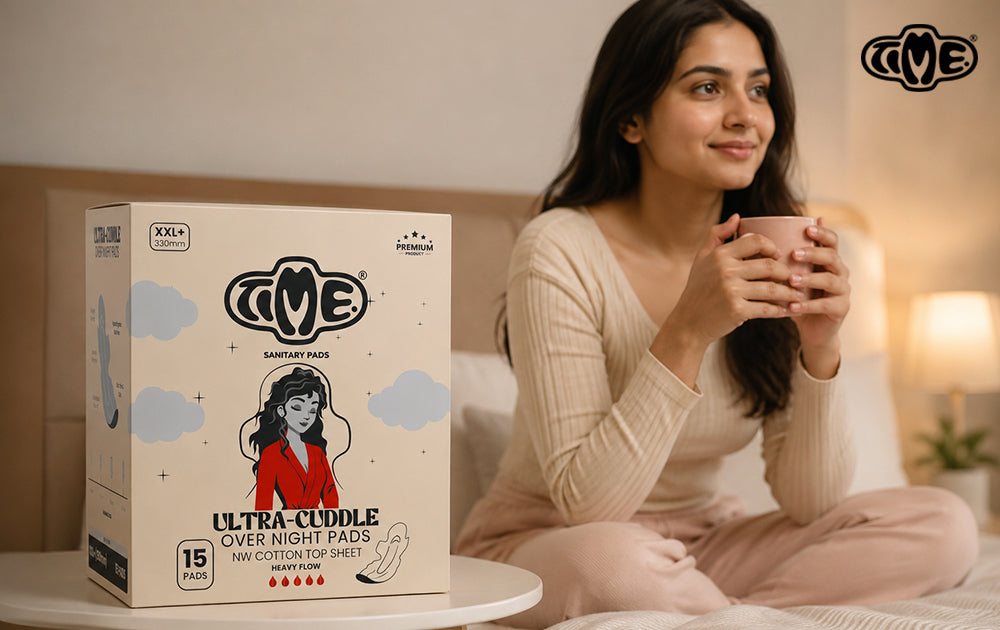 A woman is drinking coffee and the TIME sanitary product is placed on the table 